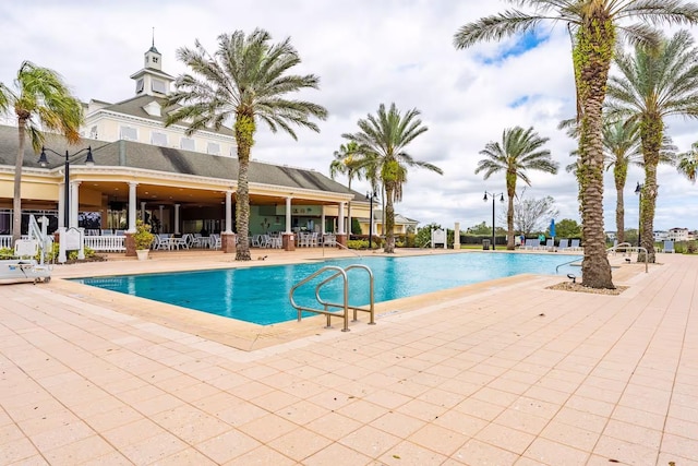 7951 Haverhill Way, Kissimmee, FL 34747 - community pool featuring a patio