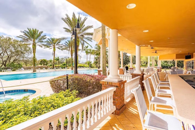 7951 Haverhill Way, Kissimmee, FL 34747 - view of patio with a hot tub and a community pool