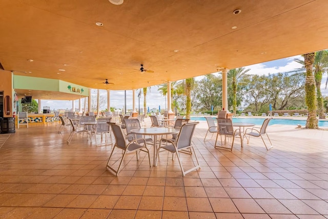 7951 Haverhill Way, Kissimmee, FL 34747 - view of patio / terrace featuring a community pool, outdoor dining space, and ceiling fan