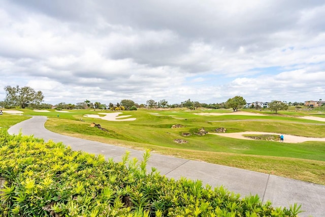 7951 Haverhill Way, Kissimmee, FL 34747 - view of home's community featuring view of golf course and a lawn