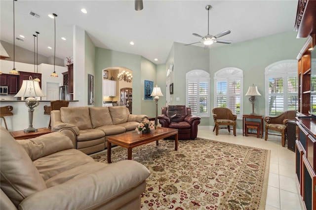 618 Manatee Bay Dr, Cape Canaveral, FL 32920 - living room with a ceiling fan, arched walkways, light tile patterned floors, a towering ceiling, and recessed lighting