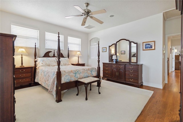 618 Manatee Bay Dr, Cape Canaveral, FL 32920 - bedroom featuring wood finished floors and a ceiling fan