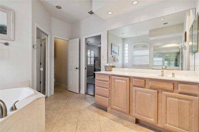 618 Manatee Bay Dr, Cape Canaveral, FL 32920 - full bathroom featuring vanity, a garden tub, tile patterned floors, and recessed lighting