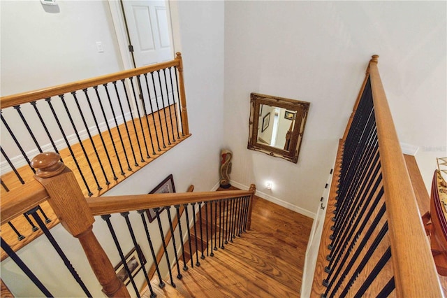 618 Manatee Bay Dr, Cape Canaveral, FL 32920 - stairway featuring wood finished floors and baseboards