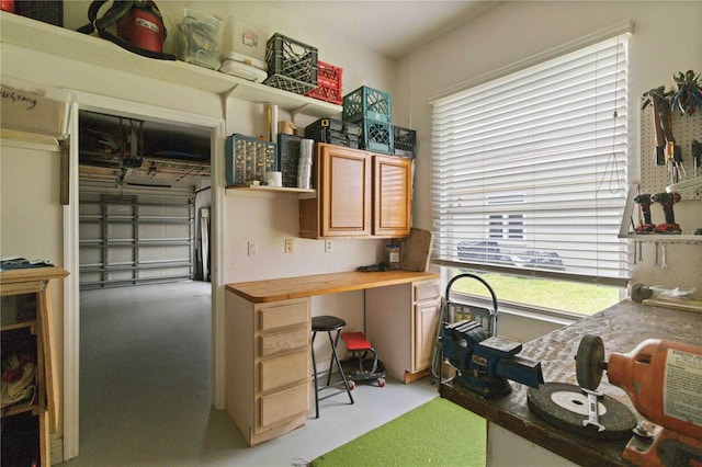 618 Manatee Bay Dr, Cape Canaveral, FL 32920 - home office with plenty of natural light and finished concrete floors