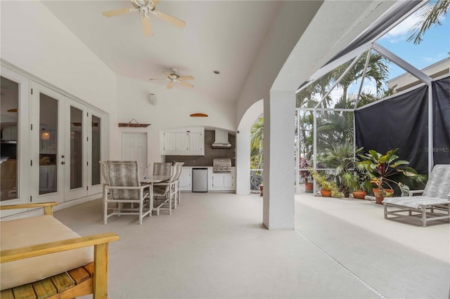 618 Manatee Bay Dr, Cape Canaveral, FL 32920 - view of patio with exterior kitchen, a ceiling fan, glass enclosure, french doors, and outdoor dining space