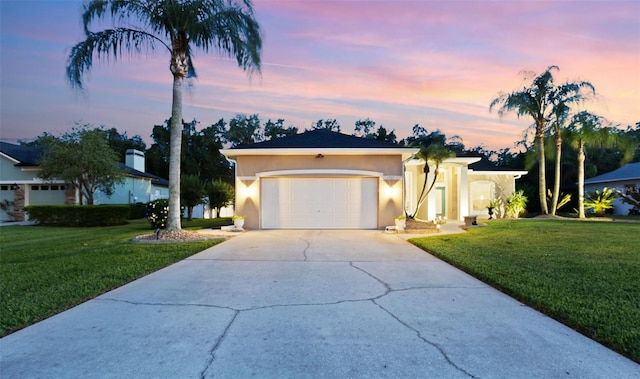 1907 Sir Lancelot Cir, Saint Cloud, FL 34772 - single story home with concrete driveway, stucco siding, a front lawn, and a garage