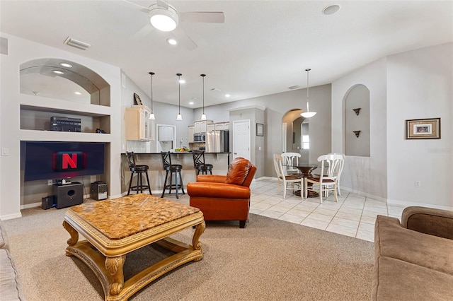 1907 Sir Lancelot Cir, Saint Cloud, FL 34772 - living area with arched walkways, a ceiling fan, baseboards, recessed lighting, and light tile patterned flooring