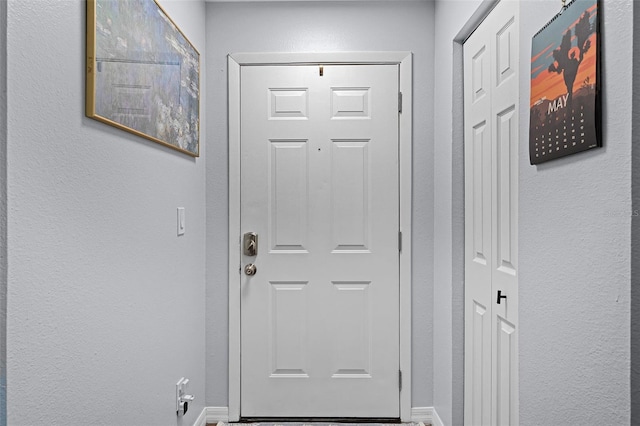 3028 Parkway Blvd Unit 308, Kissimmee, FL 34747 - entryway featuring baseboards and a textured wall