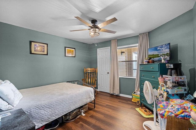 3028 Parkway Blvd Unit 308, Kissimmee, FL 34747 - bedroom featuring wood finished floors, baseboards, and a ceiling fan