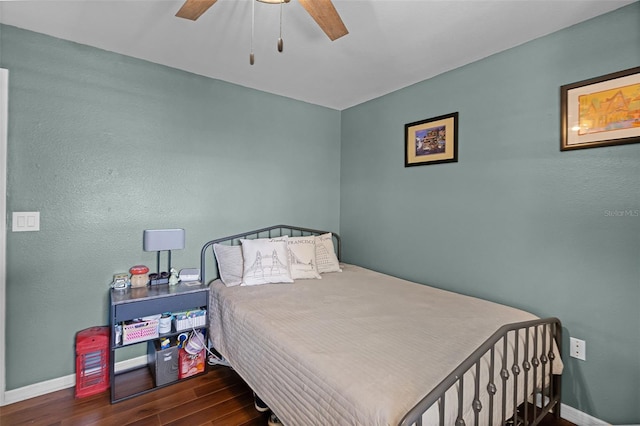 3028 Parkway Blvd Unit 308, Kissimmee, FL 34747 - bedroom with wood finished floors, baseboards, and a ceiling fan