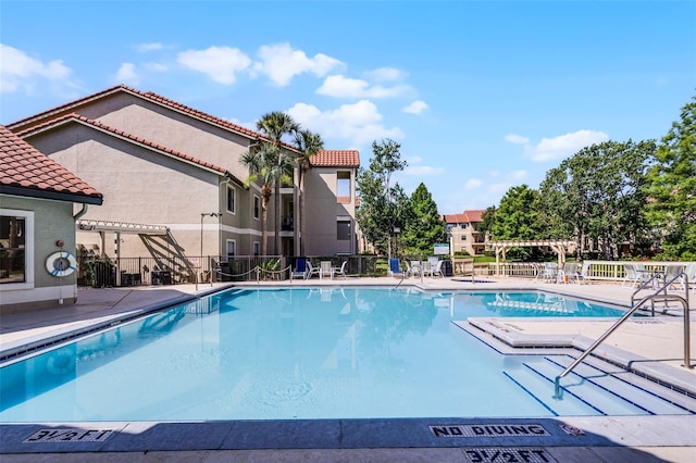 3028 Parkway Blvd Unit 308, Kissimmee, FL 34747 - community pool featuring a pergola and a patio area