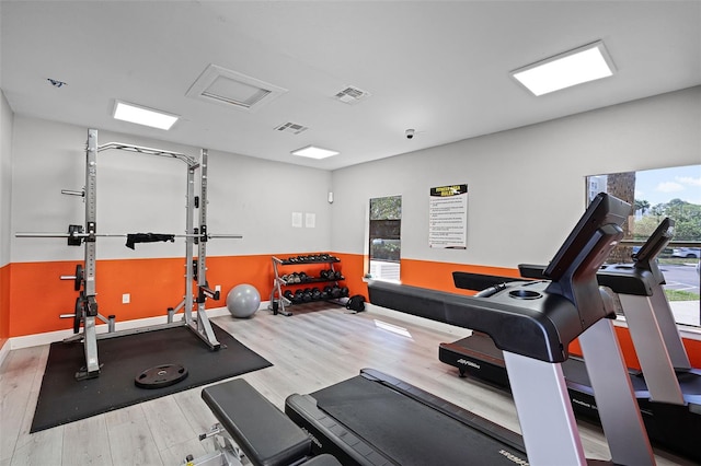 3028 Parkway Blvd Unit 308, Kissimmee, FL 34747 - workout area featuring wood finished floors and baseboards