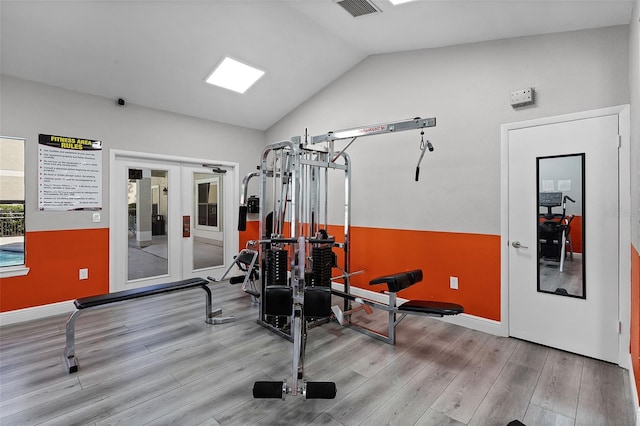 3028 Parkway Blvd Unit 308, Kissimmee, FL 34747 - exercise area with wood finished floors, vaulted ceiling, french doors, and baseboards