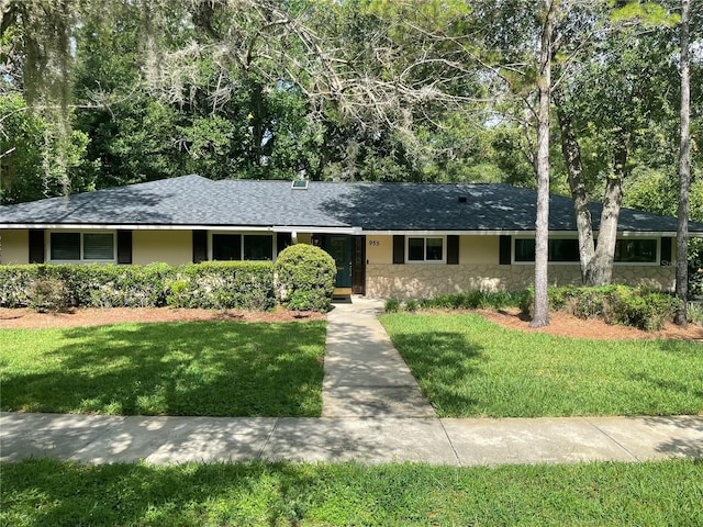955 Gamewell Ave, Maitland, FL 32751 - single story home featuring stone siding, a front yard, and roof with shingles