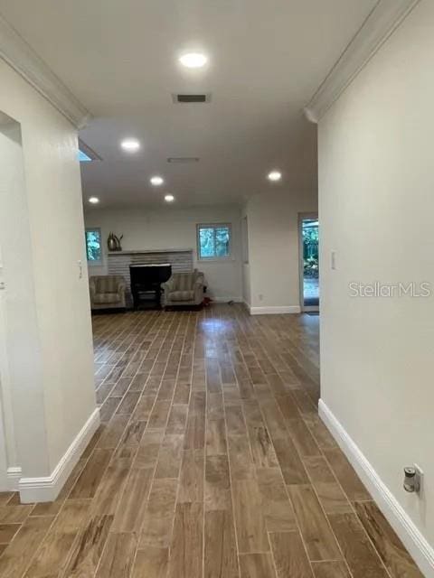 955 Gamewell Ave, Maitland, FL 32751 - corridor with wood finished floors, baseboards, recessed lighting, and crown molding