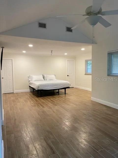 955 Gamewell Ave, Maitland, FL 32751 - bedroom with baseboards, wood finished floors, high vaulted ceiling, recessed lighting, and a ceiling fan