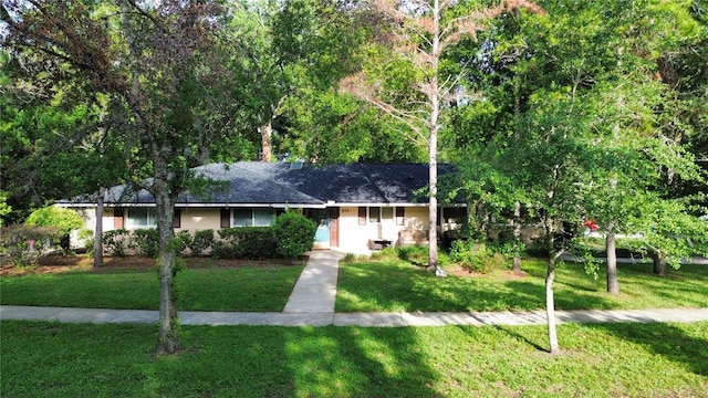 955 Gamewell Ave, Maitland, FL 32751 - view of front facade with a front yard and roof with shingles