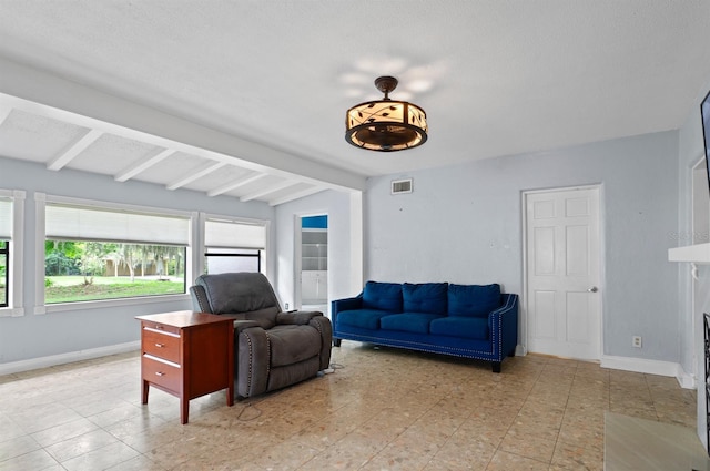 4420 Conway Gardens Rd, Orlando, FL 32806 - living room with beam ceiling and baseboards