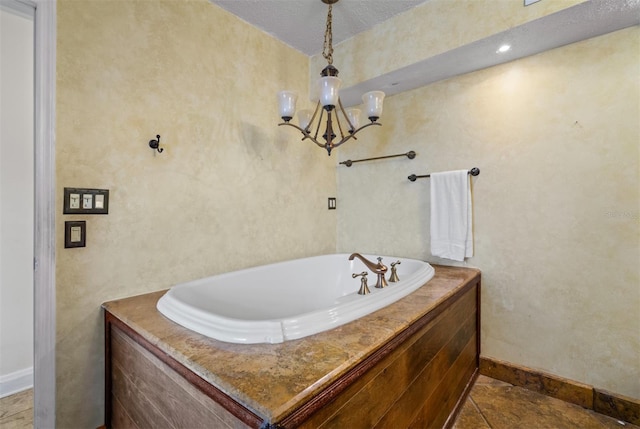 4420 Conway Gardens Rd, Orlando, FL 32806 - full bathroom featuring baseboards, a garden tub, and a chandelier