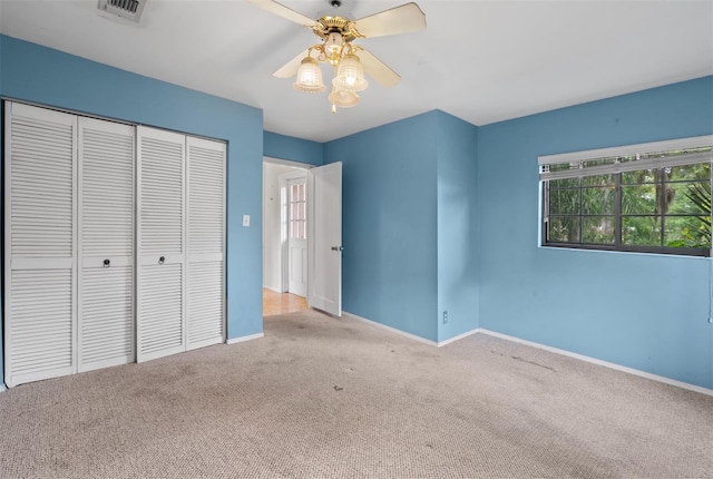 4420 Conway Gardens Rd, Orlando, FL 32806 - unfurnished bedroom with carpet floors, a closet, baseboards, and multiple windows