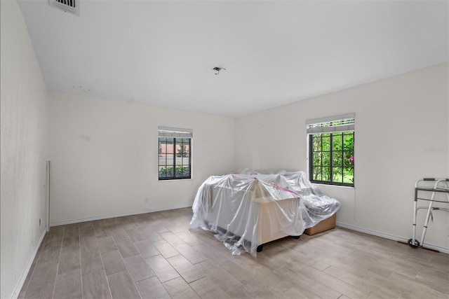 4420 Conway Gardens Rd, Orlando, FL 32806 - bedroom featuring wood finished floors and baseboards