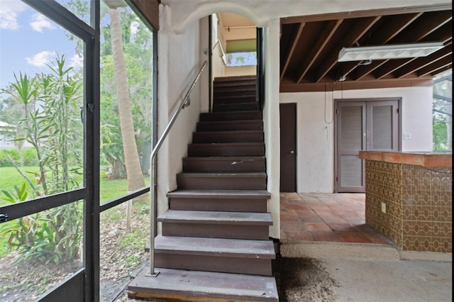 4420 Conway Gardens Rd, Orlando, FL 32806 - staircase with stone finish flooring