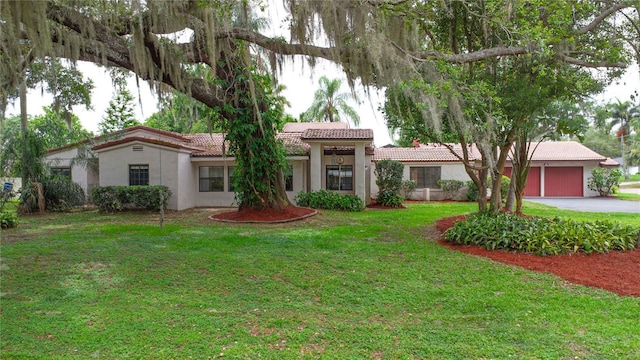4420 Conway Gardens Rd, Orlando, FL 32806 - view of front facade with stucco siding, a tile roof, a front lawn, and driveway