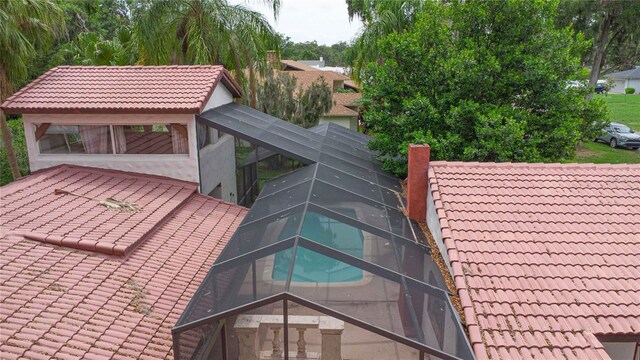 4420 Conway Gardens Rd, Orlando, FL 32806 - exterior view of a tile roof, a chimney, and stucco siding