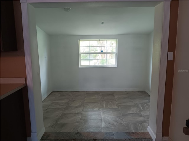 2103 Mantilla Ave, Orlando, FL 32811 - spare room featuring a smoke detector and baseboards