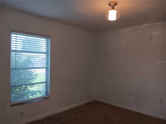 2103 Mantilla Ave, Orlando, FL 32811 - carpeted empty room with baseboards
