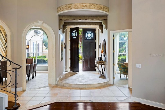 2357 Alaqua Dr, Longwood, FL 32779 - entrance foyer featuring a high ceiling, baseboards, and light wood-style flooring