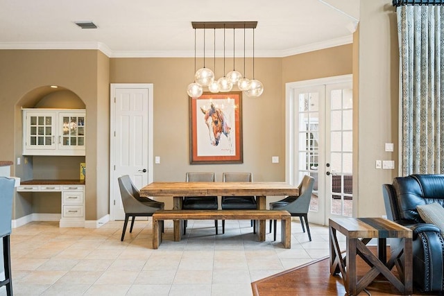 2357 Alaqua Dr, Longwood, FL 32779 - dining room with light tile patterned flooring, french doors, plenty of natural light, crown molding, and baseboards