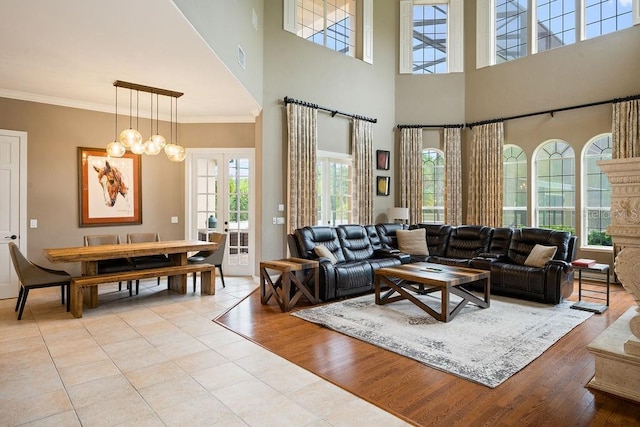 2357 Alaqua Dr, Longwood, FL 32779 - living area with a high ceiling, ornamental molding, french doors, and light wood finished floors