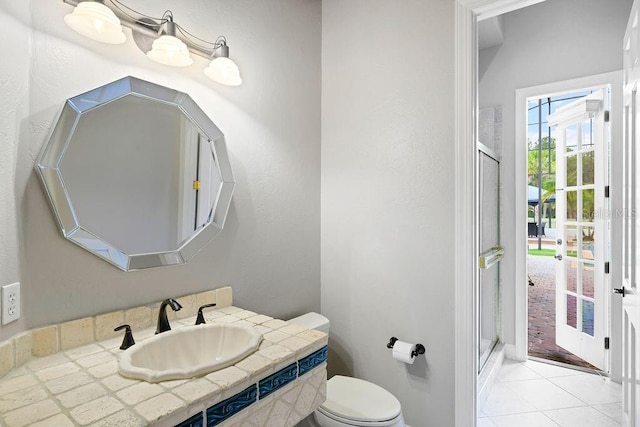 2357 Alaqua Dr, Longwood, FL 32779 - full bathroom featuring a shower stall, toilet, vanity, and tile patterned flooring