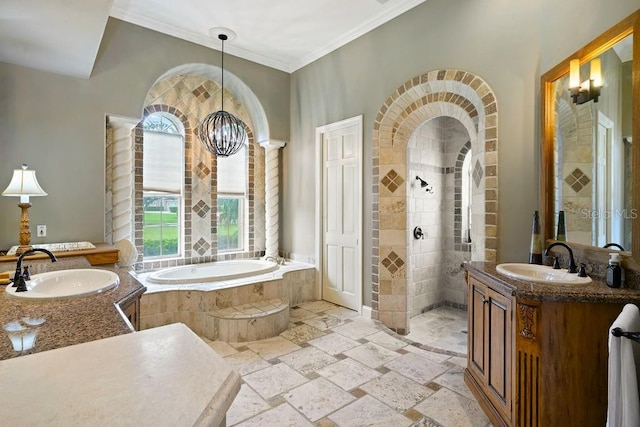 2357 Alaqua Dr, Longwood, FL 32779 - bathroom featuring stone tile flooring, a bath, two vanities, ornamental molding, and walk in shower
