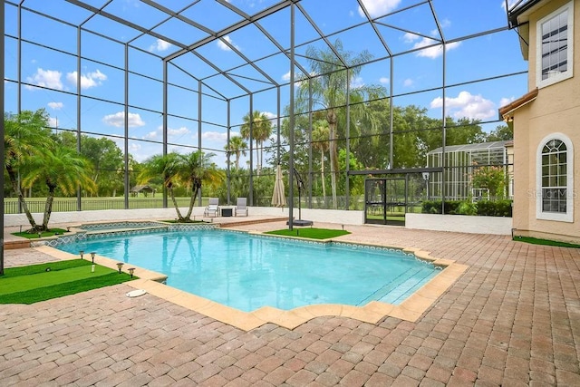 2357 Alaqua Dr, Longwood, FL 32779 - view of swimming pool with a hot tub, glass enclosure, and a patio
