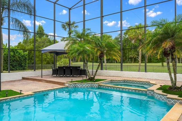2357 Alaqua Dr, Longwood, FL 32779 - view of pool featuring a patio, glass enclosure, a pool with connected hot tub, and a gazebo