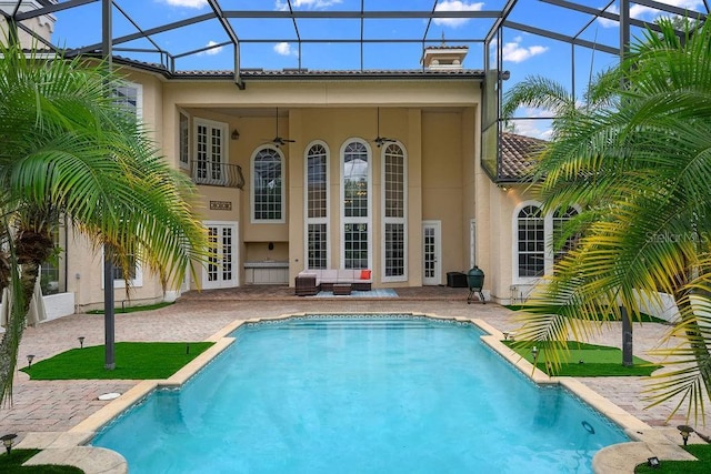 2357 Alaqua Dr, Longwood, FL 32779 - back of house featuring stucco siding, a patio area, french doors, an outdoor pool, and a lanai