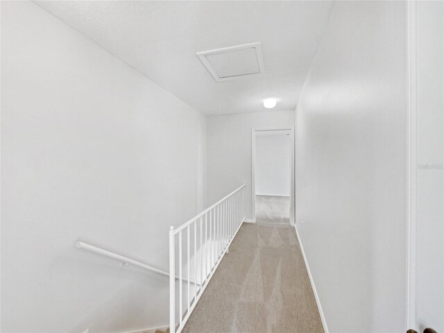 1404 Oak Pl Unit A, Apopka, FL 32712 - corridor featuring an upstairs landing, carpet flooring, baseboards, and attic access