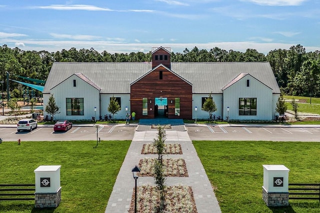 view of building exterior with uncovered parking
