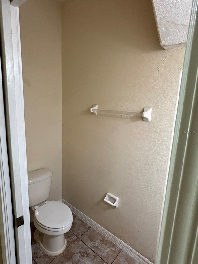 11187 Savannah Landing Cir, Orlando, FL 32832 - bathroom featuring toilet, tile patterned floors, and baseboards