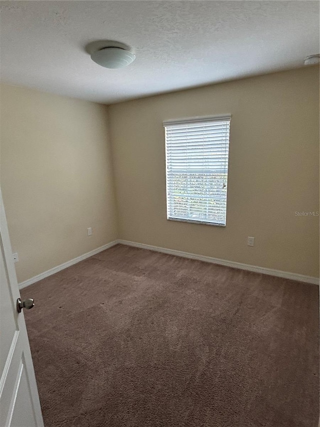 11187 Savannah Landing Cir, Orlando, FL 32832 - spare room featuring carpet floors, baseboards, and a smoke detector