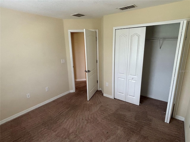 11187 Savannah Landing Cir, Orlando, FL 32832 - unfurnished bedroom with carpet, a closet, and baseboards