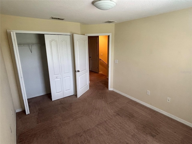 11187 Savannah Landing Cir, Orlando, FL 32832 - unfurnished bedroom with carpet floors, a closet, and baseboards