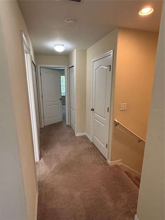11187 Savannah Landing Cir, Orlando, FL 32832 - hallway with carpet flooring, baseboards, and an upstairs landing