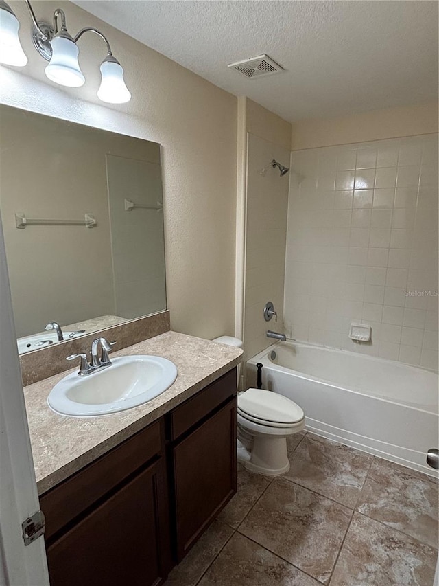 11187 Savannah Landing Cir, Orlando, FL 32832 - full bathroom featuring vanity, a textured ceiling, toilet, bathing tub / shower combination, and tile patterned flooring