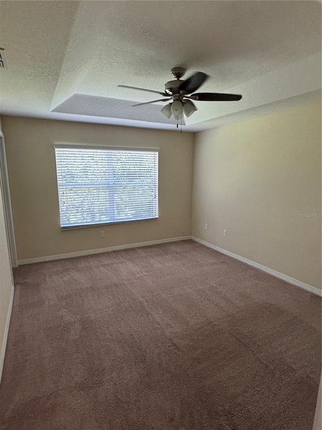 11187 Savannah Landing Cir, Orlando, FL 32832 - empty room with a ceiling fan, a textured ceiling, carpet, and baseboards