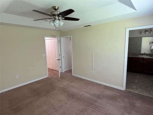 11187 Savannah Landing Cir, Orlando, FL 32832 - unfurnished bedroom with carpet flooring, a sink, baseboards, and connected bathroom