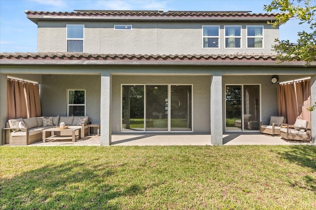 2340 Standing Rock Cir, Oakland, FL 34787 - back of property featuring an outdoor living space, a patio area, stucco siding, and a yard